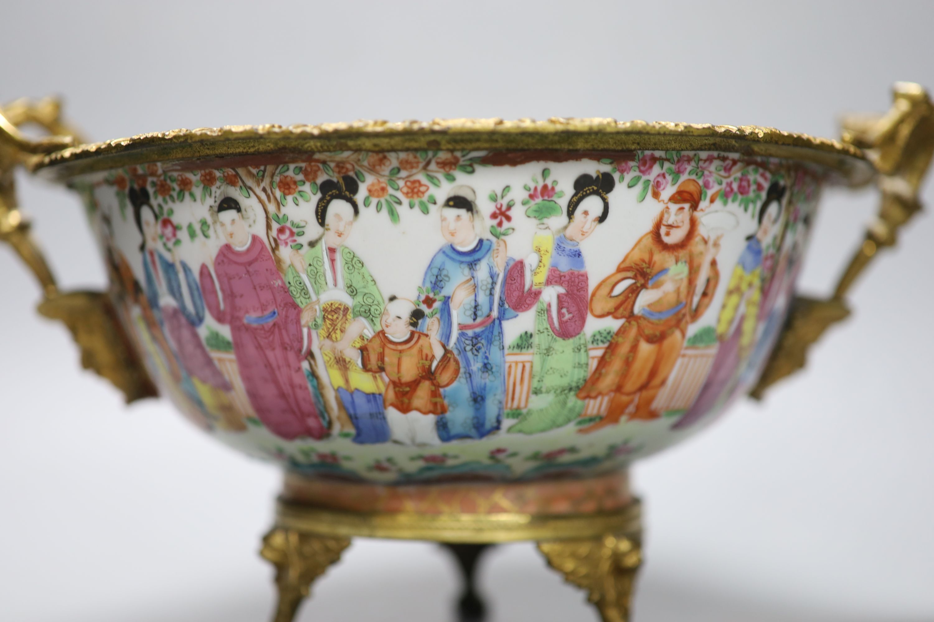 An early 19th century Chinese ormolu mounted famille rose bowl, 30cm handle to handle